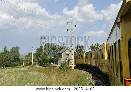 Latour De Carol - September 4, 2018: The Small Yellow Train Of The Pyrenees Crossing A Beautiful Mou