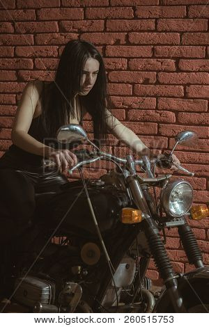 Backstreet. Backstreet Girl On Motorbike. Girl Biker On Motorcycle In Backstreet. Backstreet Woman B