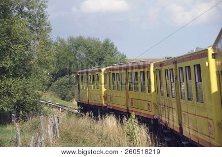 Latour De Carol - September 4, 2018: The Small Yellow Train Of The Pyrenees Crossing A Beautiful Mou