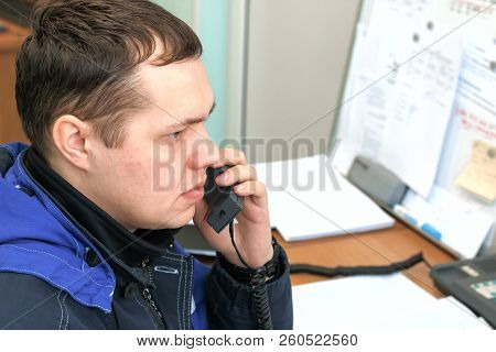 The Dispatcher Answers The Phone. Young Man In The Workplace.