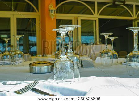 Elegant Restaurant On French Riviera  Waiting For Guests, Served Dinner Table With Glasses, Tablewar