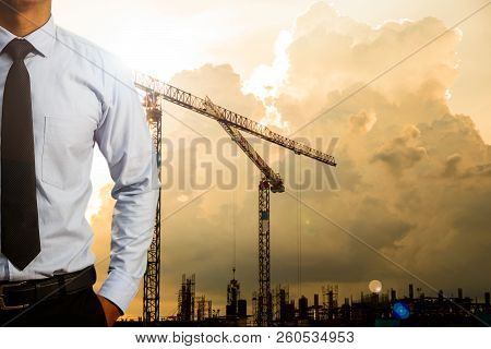 Engineers And Construction Of Buildings And Evening Lighting.