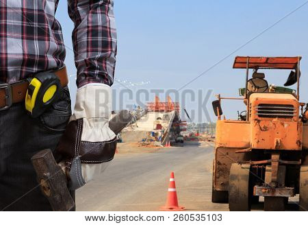 Workers Man Working In Roadside Construction Work.
