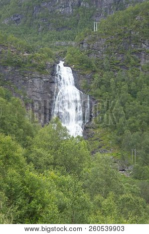 Fossen Bratte Waterfall In Norway, On A Summer Day