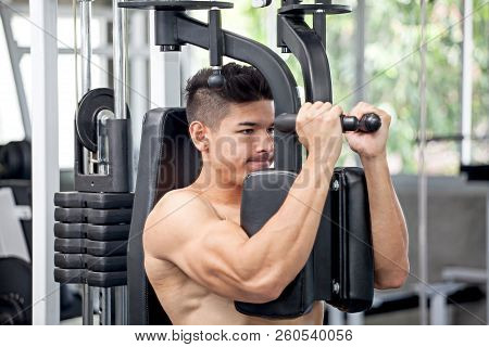 Muscular Bodybuilder Guy Doing Heavy Weight Exercise For Chest In The Gym .sport Young Fitness Man T