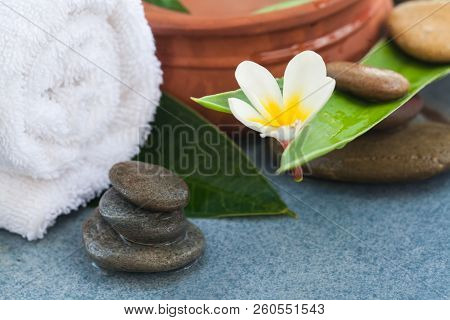 Tropical Comosition For Massage Treatment On Blue Background.