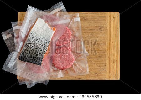 Salmon And Beef Burger Patties Vacuum Packed For Sous-vide Cooking To Be Immersed In Water Or Ready 