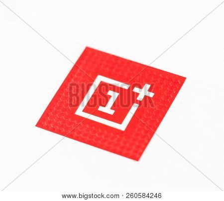 Khakiv, Ukraine - 14 August 2018: Red square logotype of smartphone OnePlus 6 with white background