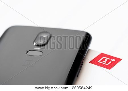 Khakiv, Ukraine - 14 August 2018: Smartphone OnePlus 6 on the white and red box and wooden table