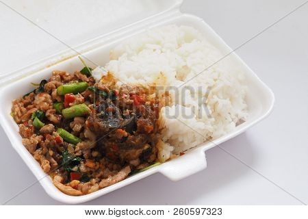 Stir-fried Crispy Pork With Chilies And Holy Basil Leaf On Rice In Foam Box For Take Home