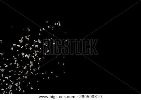 Split Debris Of Stone Exploding Against Black Background.
