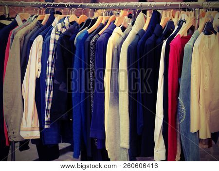 Many Vintage Clothes For Sale At Flea Market With Vintage Effect