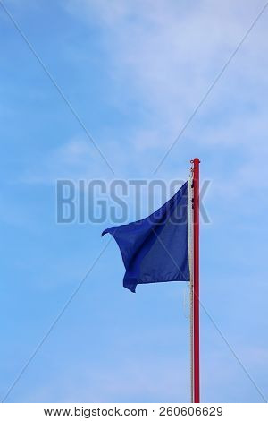 Blue Flag Waves On The Sky. This Is The Symbol Of Without Pollution In This Area