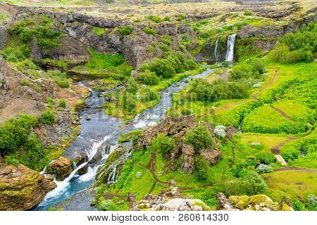 Aerial View Of The Waterfall And The Stream In The Gjain Canyon In Highlands Of Iceland