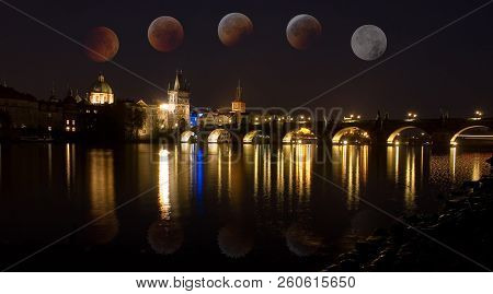 The Charles Bridge Over The Vltava River, In Prague With Total Eclipse Of Moon