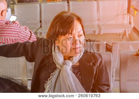 Old Asian Women Traveler Waiting For Transit In Shang Hai Airport Bus Terminal