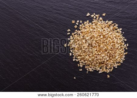 Fragrant Dried Parsnip On A Dark Stone Background