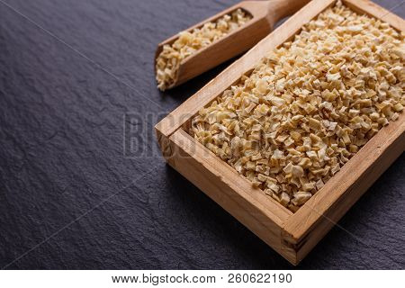Fragrant Dried Parsnip On A Dark Stone Background
