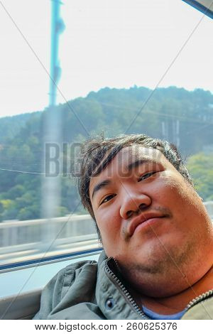 Asian Fat Traveler Selfie Himself On The High Speed Train From Yiwu City To Shanghai City In China