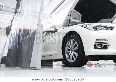 Cars In A Carwash. Car Wash With Foam In Car Wash Station. Carwash. Washing Machine At The Station. 