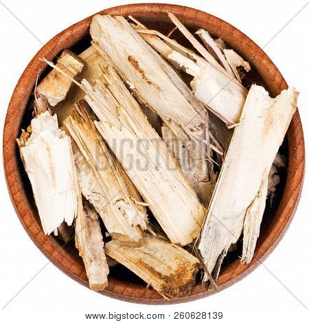 Dry Burdock In A Small Wooden Bow Isolated On White.