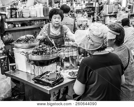 Seoul, South Korea - June 21, 2017: People Eating Tasty Food And Drink At Gwangjang Market In Seoul.