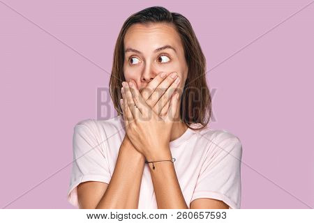 Emotive Stupefied Young Female, Covers Mouth As Tries To Be Speechless, Looks With Popped Eyes, Stan