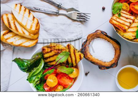 Cherry Tomato Salad With Grilled Haloumi Cheese, With Chard And Arugula