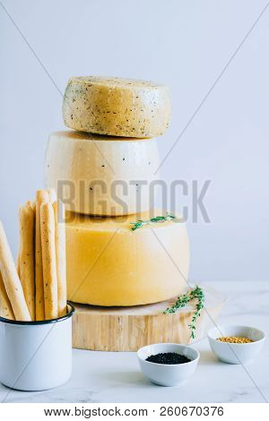 Assorted Cachotta Cheese Head With Black Cumin, Fenugreek And Herbs In Cake Stand With Bread Sticks 