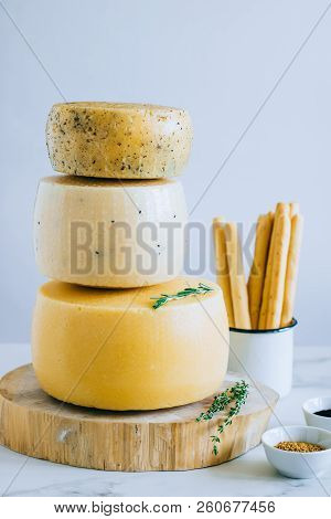 Assorted Cachotta Cheese Head With Black Cumin, Fenugreek And Herbs In Cake Stand With Bread Sticks 