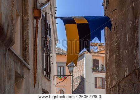 Town Orte In Umbria. Medieval Tradition Of The City Of Orte, Decorating The Streets With Flags Of Th