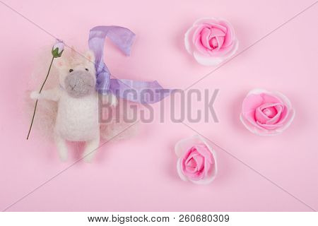 Tiny Unicorn Toy Made Of Wool And Handmade Rose Buds On A Pastel Pink Background (top View), Copy Sp