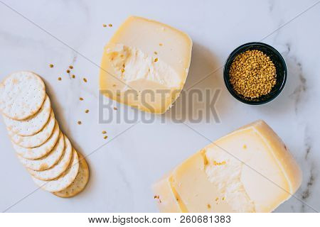 Cachotta Cheese With With Fenugreek, Jam, Baguette, Crackers, Rosemary And Thyme On Marble