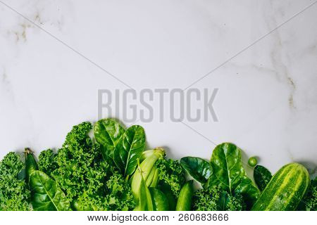 Frame Of Fresh Green Vegetables On A Marble Background, Copy Space, Flay Lay, Top View