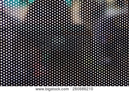Close Up A Dot Pattern Of A Film Lighting Filter On The Public Bus Mirror For Backgroud Texture