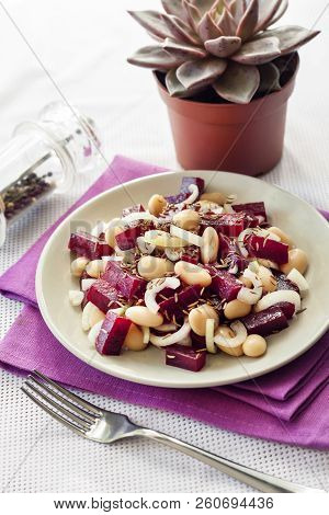 Beetroot Salad With White Kidney Beans, Pickles And Onion, Dressed With Oil And Flavored With Carawa