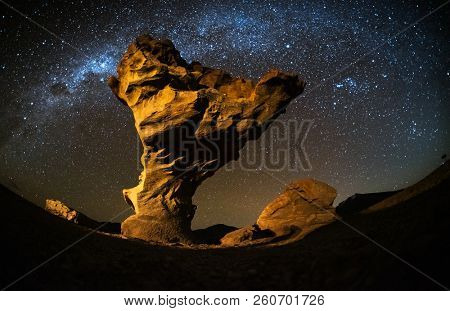 Starry sky with the star trails like comets and rock formation named Arbol de Piedra (Stone Tree) in Eduardo Avaroa Andean Fauna National Reserve of Sur Lipez Province, Bolivia