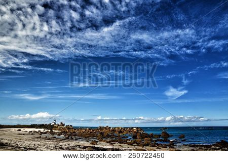 Phare de Pontusval, small lighthouse in the rocks on the beach at Brignogan-Plage, Brittany, France