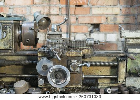 Old Machinery In A Factory From The Mid-20th C. Working Machine-tool. Old Lathe.