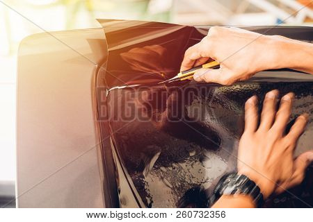 Man Specialist Service Attached Window Film By Cutter On Car
