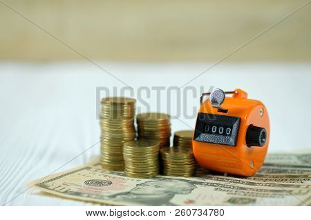 Tally Counter Or Counting Machine With 0000 Number, Coin And Banknote, Business And Finance Concept 
