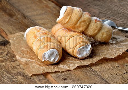 Custard Tube Of Pastry Filled With Cream - Dessert Cake - Traditional Czech Sweet On Baking Paper On