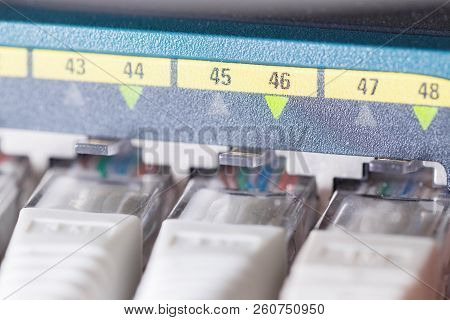 Close-up Of High Speed Network Switch And Cables In Datacenter