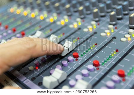 Close-up Hand Of Man Control Mixing Console Of A Big Hifi System The Audio Equipment, Control Panel 