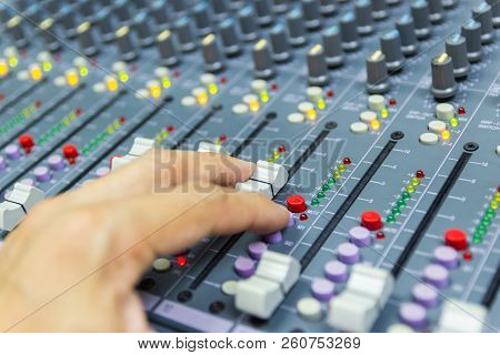 Close-up Hand Of Man Control Mixing Console Of A Big Hifi System The Audio Equipment, Control Panel 
