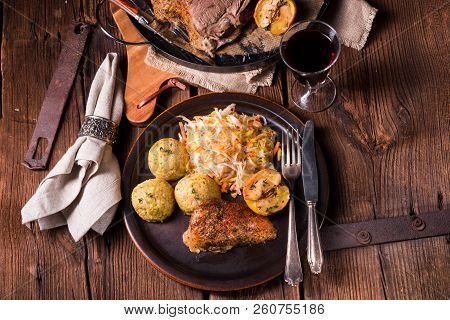 Classic And Crispy Roasted Duck With Cabbage And Dumplings
