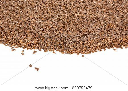 Lot Of Whole Fresh Brown Flaxseeds Isolated On White Background