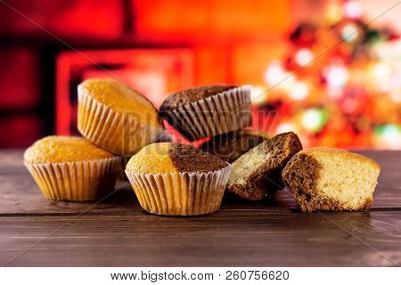 Group Of Five Whole Two Halves Of Fresh Baked Marble Muffin With Christmas Tree In Red Background