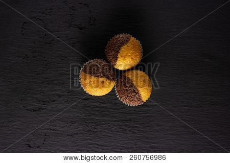Group Of Three Whole Fresh Baked Marble Muffin Flatlay On Grey Stone