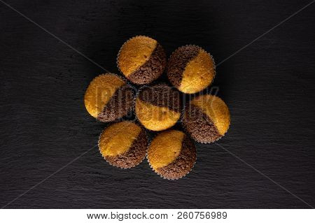 Group Of Seven Whole Fresh Baked Marble Muffin Flatlay On Grey Stone